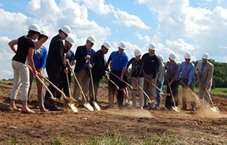groundbreaking ceremony people with shovels